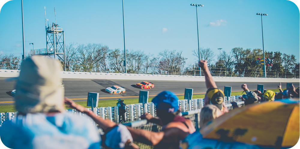 Photo of two race cars with fans